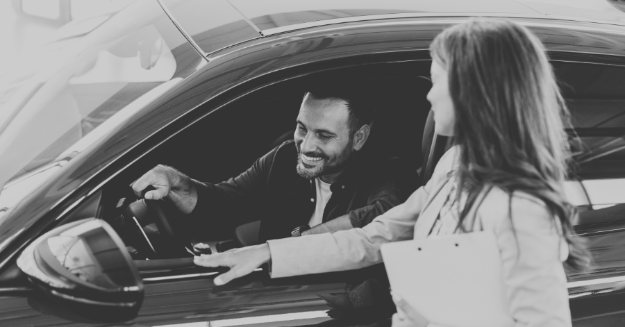 Young man test driving car