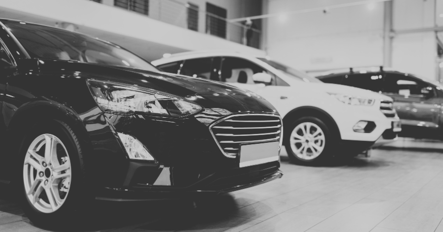 Close-up look of black car sitting in dealership showroom