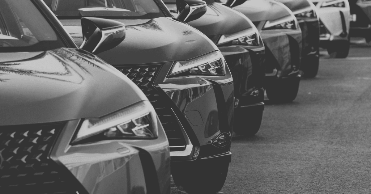 Line of new cars on dealer lot