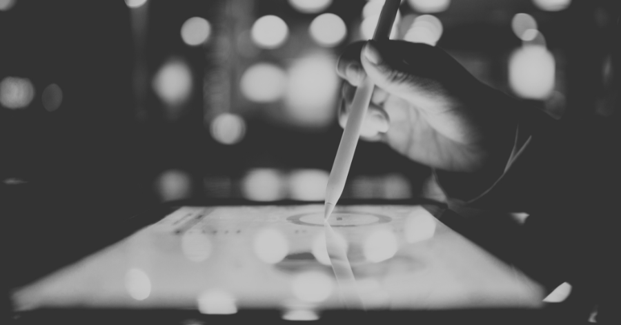 Person using smart pen on tablet