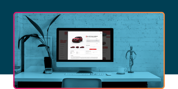 Desktop workspace displaying a dealership website optimized for SEO and AEO, highlighting vehicle listings and search-focused content.