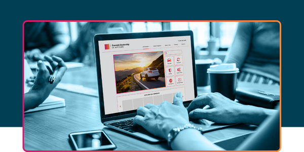 Hands using a laptop to browse a modern, responsive dealership website, showcasing vehicle inventory and conversion-focused design.